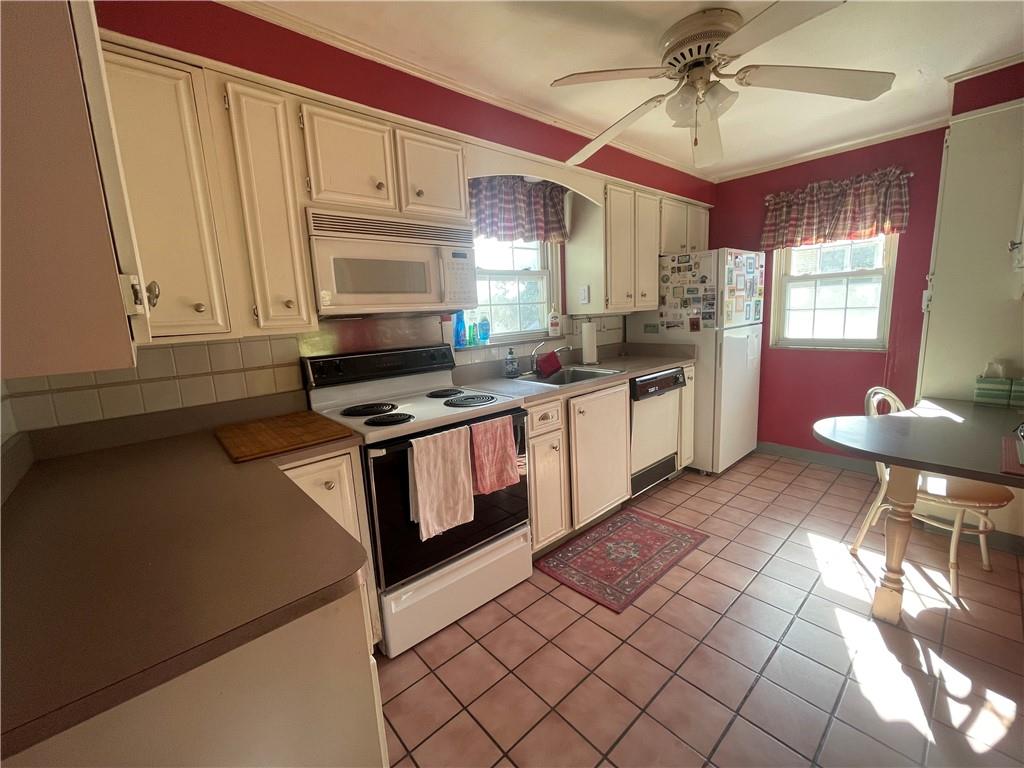 1018 Grandview Avenue Pittsburgh, PA 15237 - Photo 10 of 29 a kitchen with stainless steel appliances granite countertop a stove a sink and a microwave