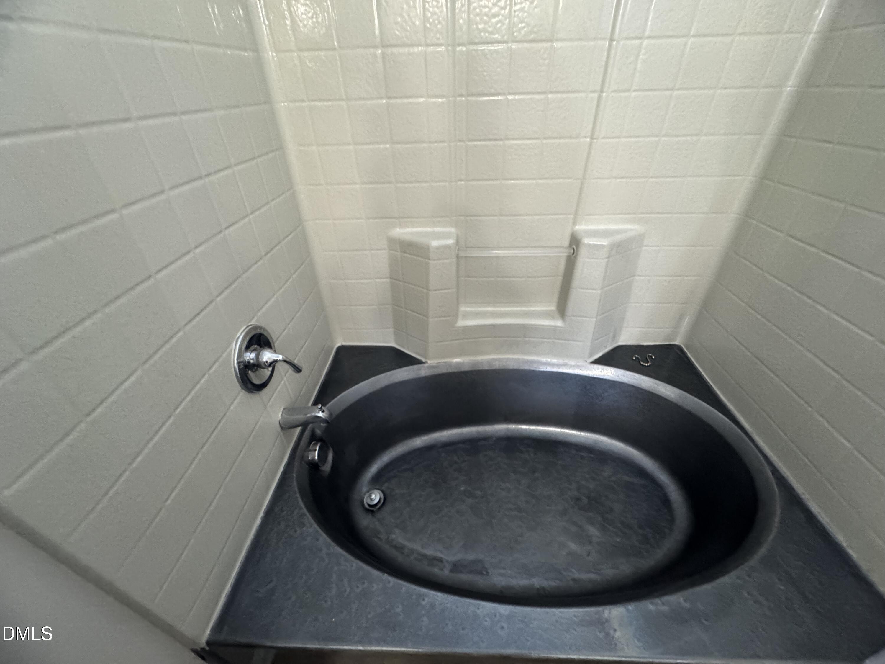 4008 Landover Lane Raleigh, NC 27616 - Photo 12 of 19 a bathroom with a bathtub
