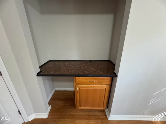 a view of a livingroom with furniture and a window