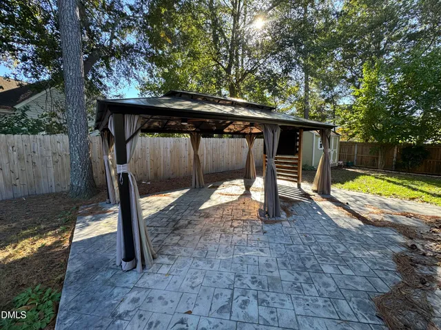 a view of backyard with green space