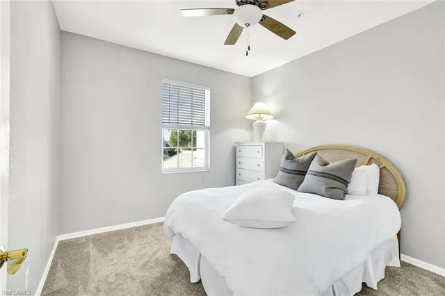a bathroom with a sink a toilet a mirror a vanity and shower