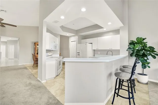 a kitchen with counter top space and appliances