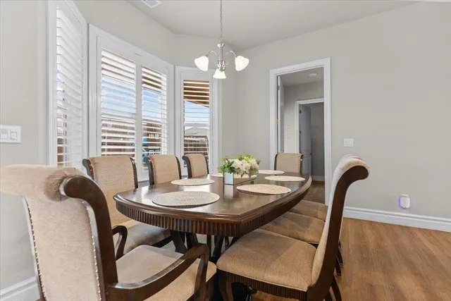 a view of a dining room with furniture and window
