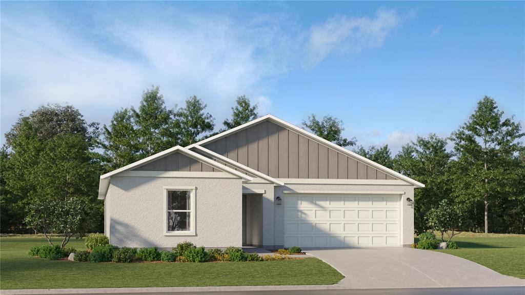 1141 Hour Glass Road Lakeland, FL 33801 - Photo 1 of 1 a view of a white house next to a yard and large trees