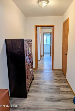 a bedroom with a bed and flat screen tv