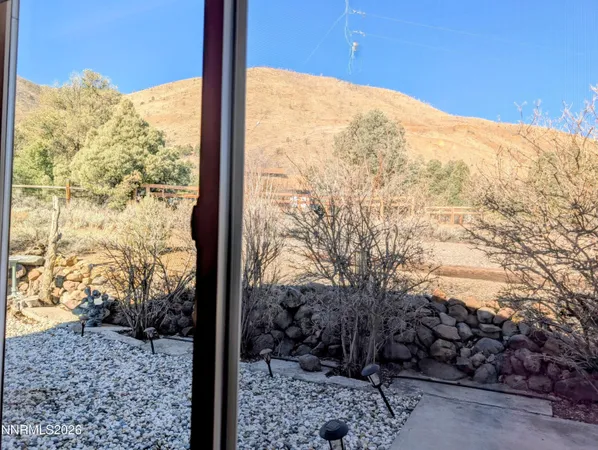 a view of an empty room with a tv