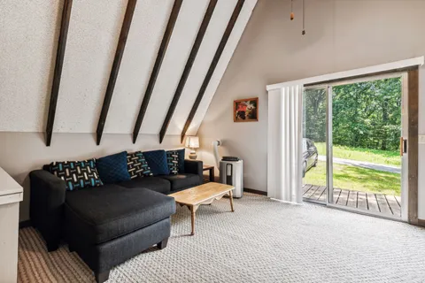 a view of a hallway with white appliances