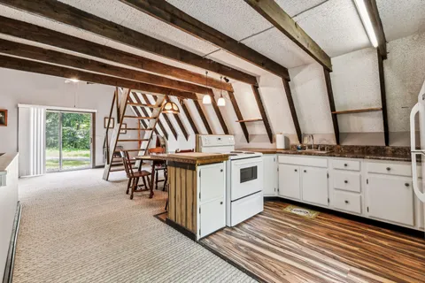 a bedroom with bed and a window