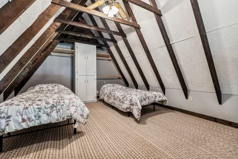 a view of a room with wooden walls