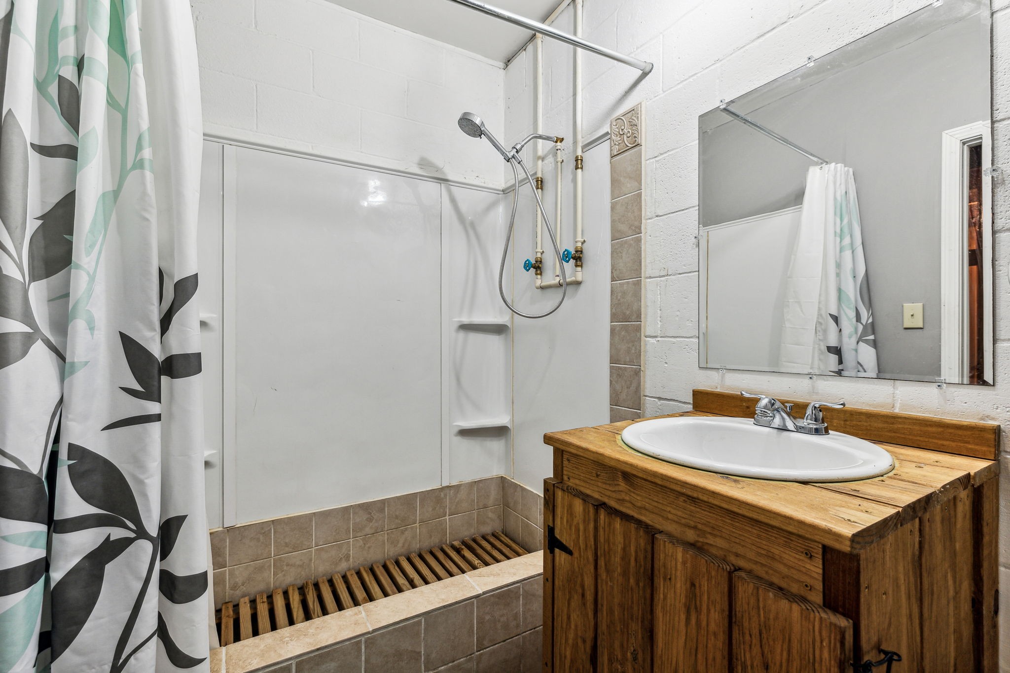 111 Mud Hill Road Dover, TN 37058 - Photo 24 of 62 a bathroom with a sink and a mirror