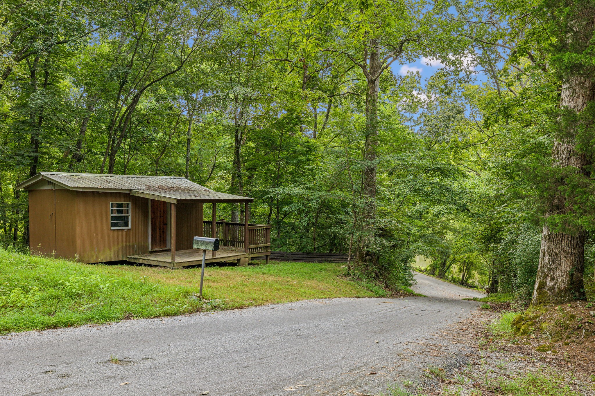111 Mud Hill Road Dover, TN 37058 - Photo 43 of 62 a front view of a house with garden