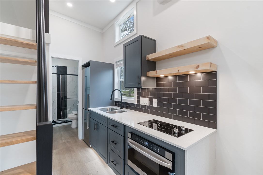 7150 Garner Road, Unit 4 Huron, NY 14590 - Photo 9 of 22 Gorgeous kitchen! Granite counter with a cooktop a