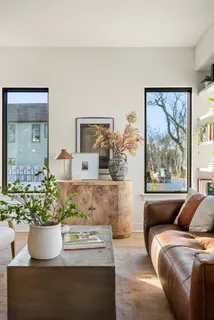 a living room with furniture and large window