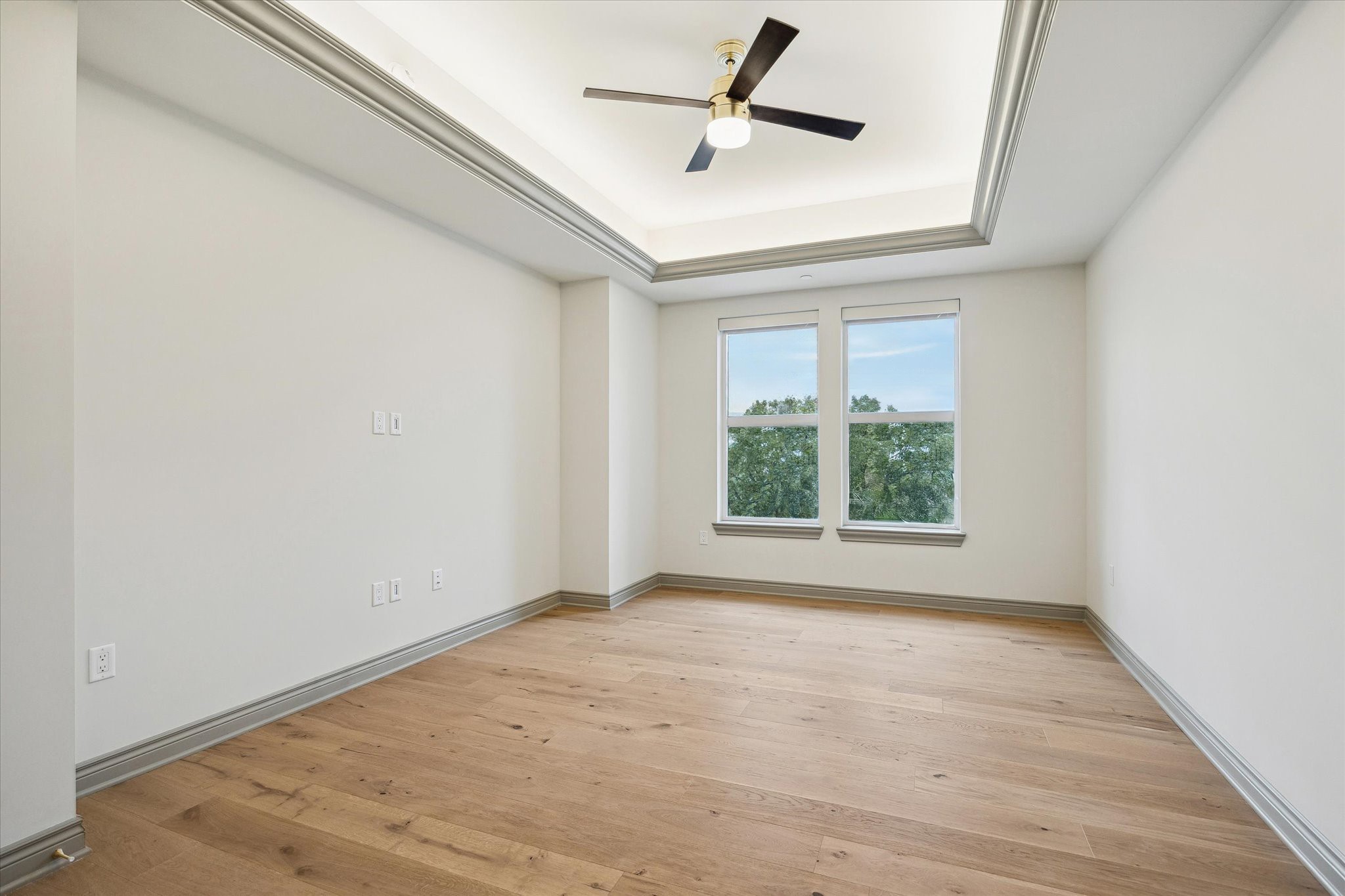 1717 Bissonnet Street, Unit 1604 Houston, TX 77005 - Photo 19 of 31 a view of empty room with wooden floor and fan