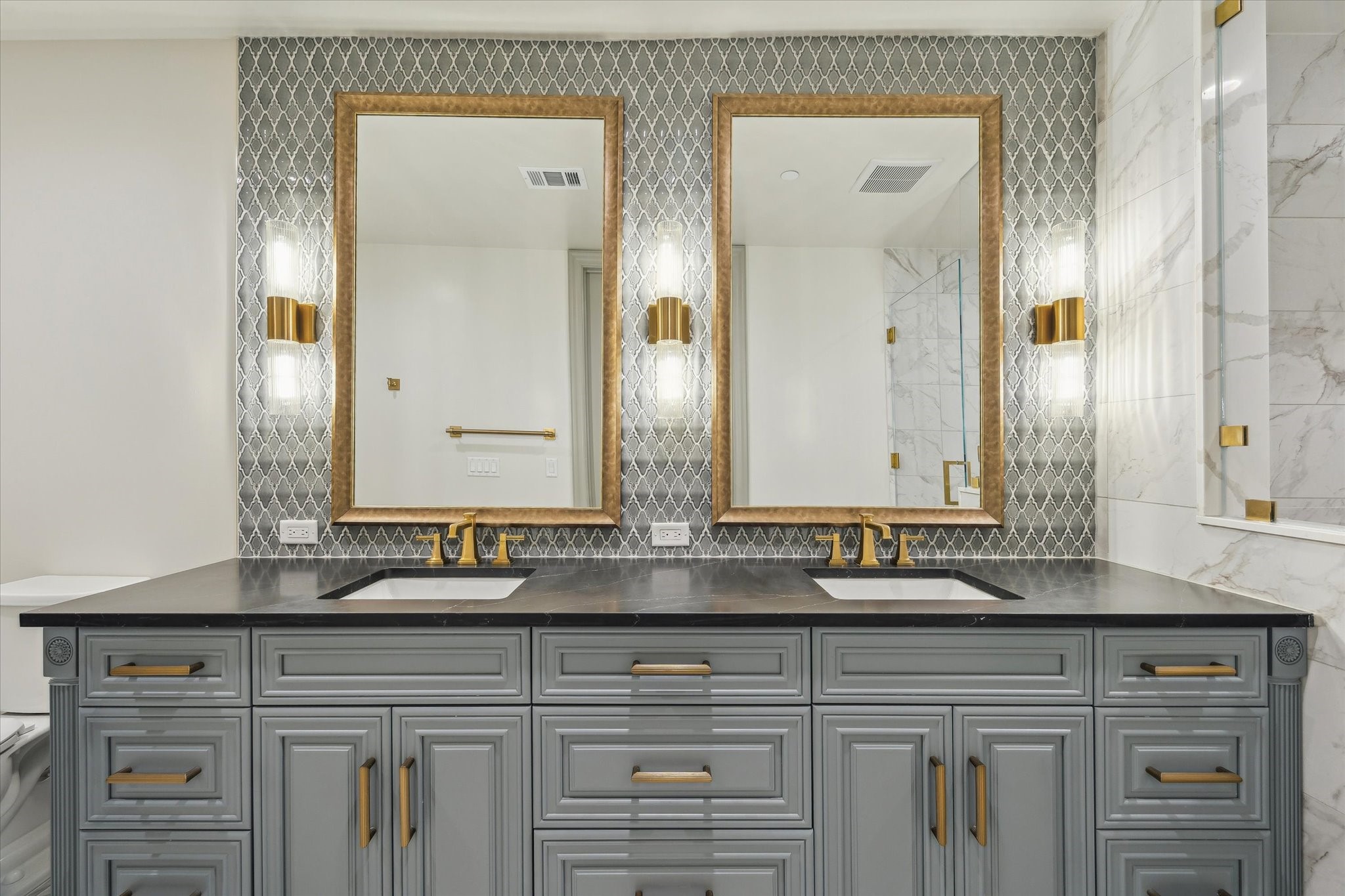 1717 Bissonnet Street, Unit 1604 Houston, TX 77005 - Photo 22 of 31 a bathroom with double sink and a mirror