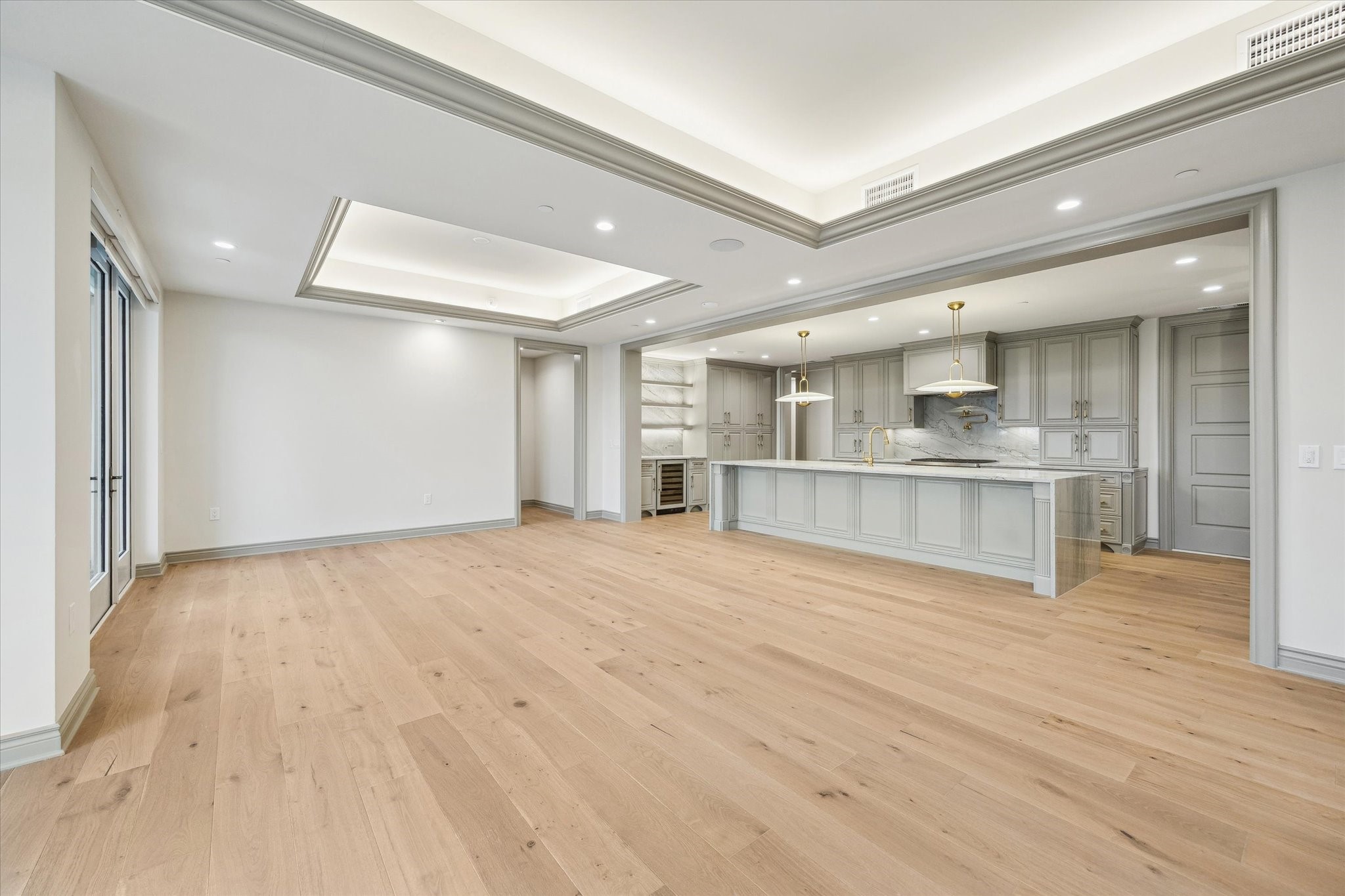 1717 Bissonnet Street, Unit 1604 Houston, TX 77005 - Photo 31 of 31 a view of an empty room and kitchen view with wooden floor