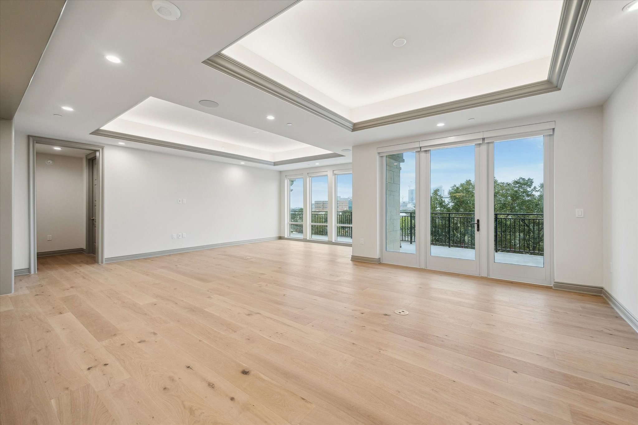 1717 Bissonnet Street, Unit 1604 Houston, TX 77005 - Photo 7 of 31 a view of an empty room with wooden floor and a window
