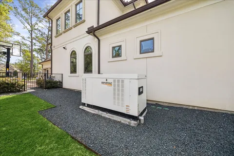 a view of a white house with a yard