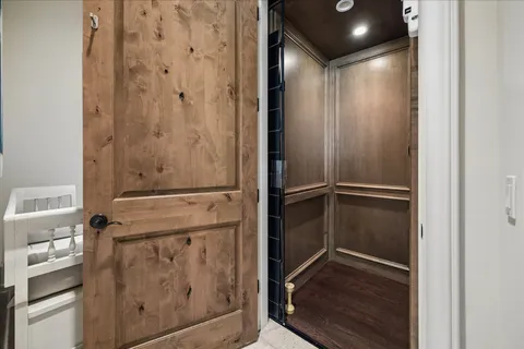a bathroom with a glass shower door