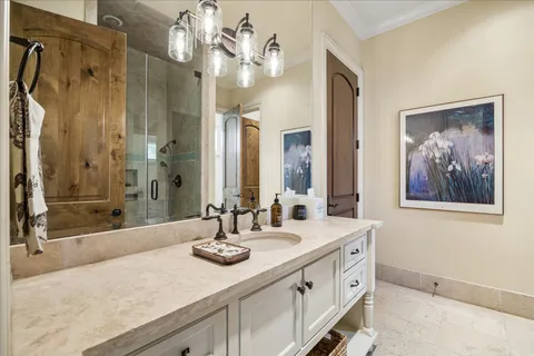 a bathroom with a sink a toilet and shower curtain