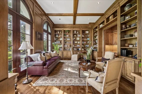 a living room with furniture or couch and a floor to ceiling window