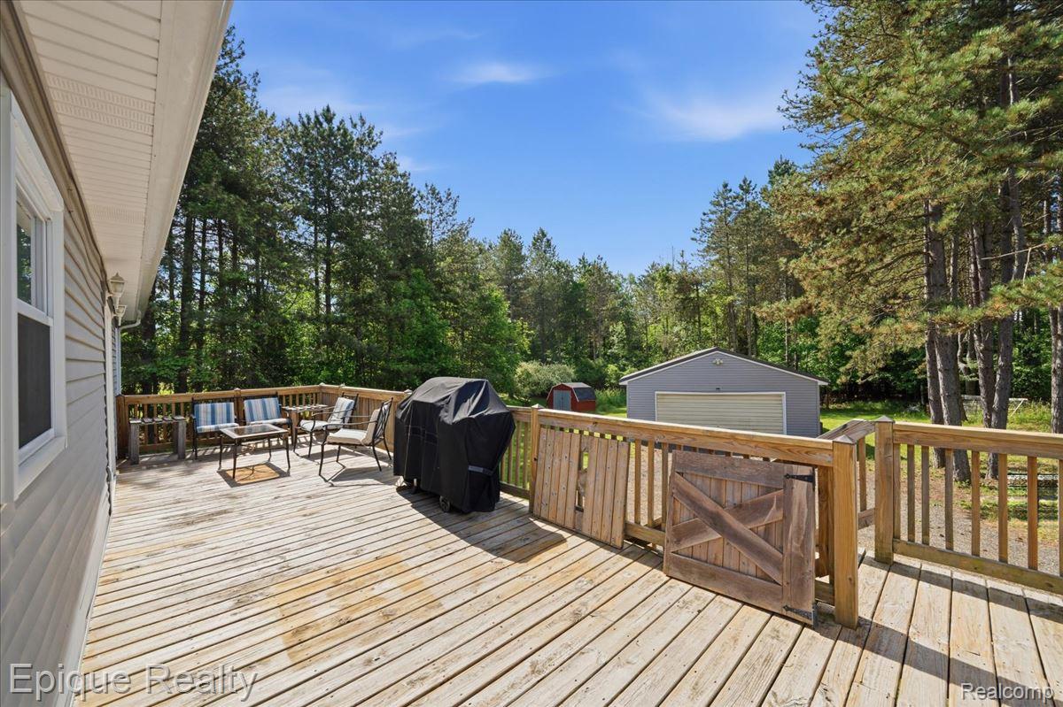 12272 East Mt Morris Road Davison, MI 48423 - Photo 27 of 39 Expansive wood deck with a full railing system