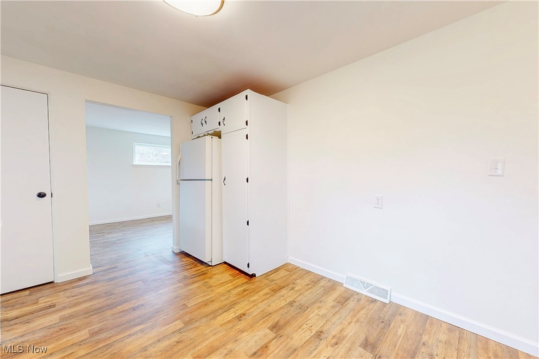 1723 Bantam Ridge Road Steubenville, OH 43953 - Photo 10 of 22 Empty room with light wood finished floors, baseboards, and visible vents