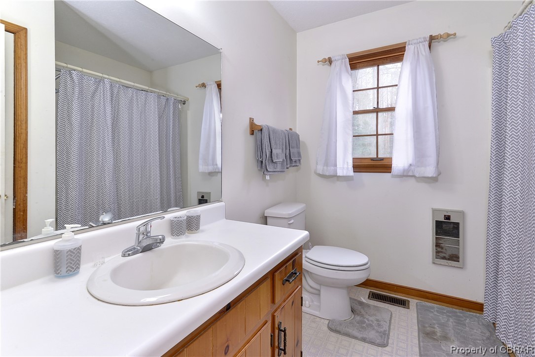 5301 North Courthouse Road Providence Forge, VA 23140 - Photo 14 of 26 a bathroom with a sink toilet and a mirror