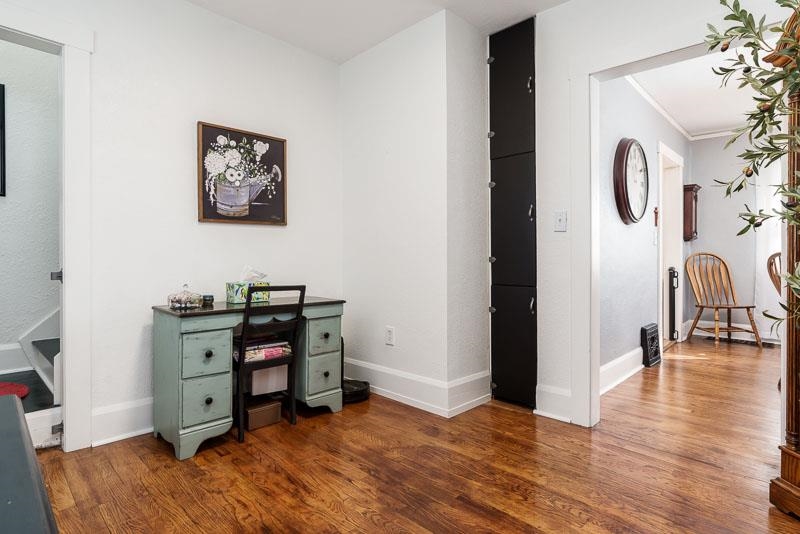 620 Harlem Road Machesney Park, IL 61115 - Photo 17 of 42 a view of a workspace with furniture and wooden floor