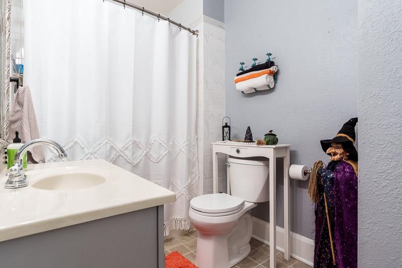 620 Harlem Road Machesney Park, IL 61115 - Photo 18 of 42 a bathroom with a sink and a toilet