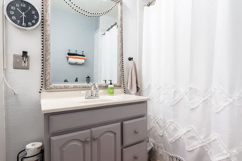 620 Harlem Road Machesney Park, IL 61115 - Photo 19 of 42 a bathroom with a sink and a mirror