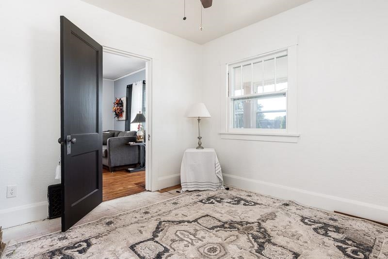 620 Harlem Road Machesney Park, IL 61115 - Photo 21 of 42 a bedroom with a bed and wooden floor
