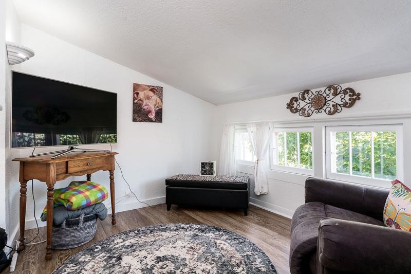 620 Harlem Road Machesney Park, IL 61115 - Photo 27 of 42 a living room with furniture and a flat screen tv