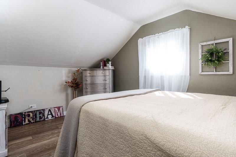 620 Harlem Road Machesney Park, IL 61115 - Photo 28 of 42 a bedroom with a bed and a window