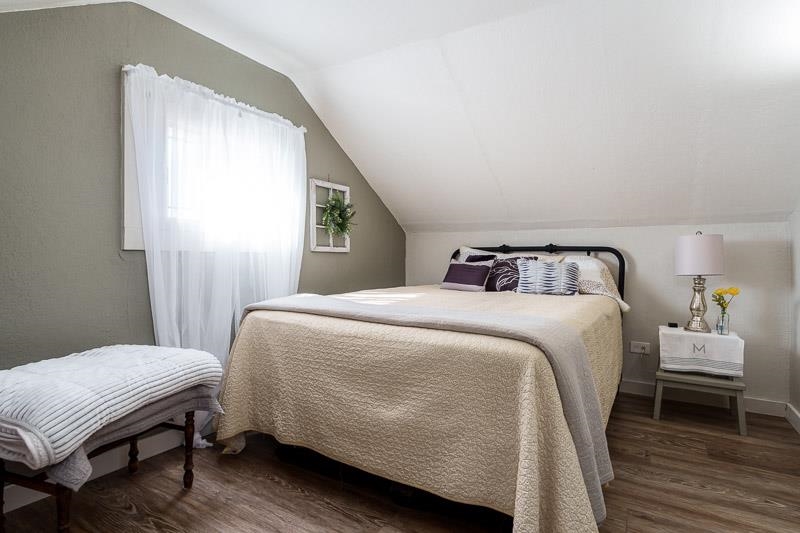 620 Harlem Road Machesney Park, IL 61115 - Photo 29 of 42 a bedroom with a bed and wooden floor