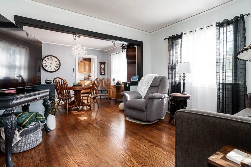 620 Harlem Road Machesney Park, IL 61115 - Photo 3 of 42 a living room with furniture and wooden floor