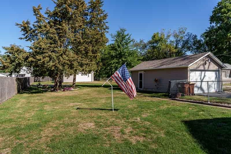 620 Harlem Road Machesney Park, IL 61115 - Photo 33 of 42 a house that has a tree in front of it