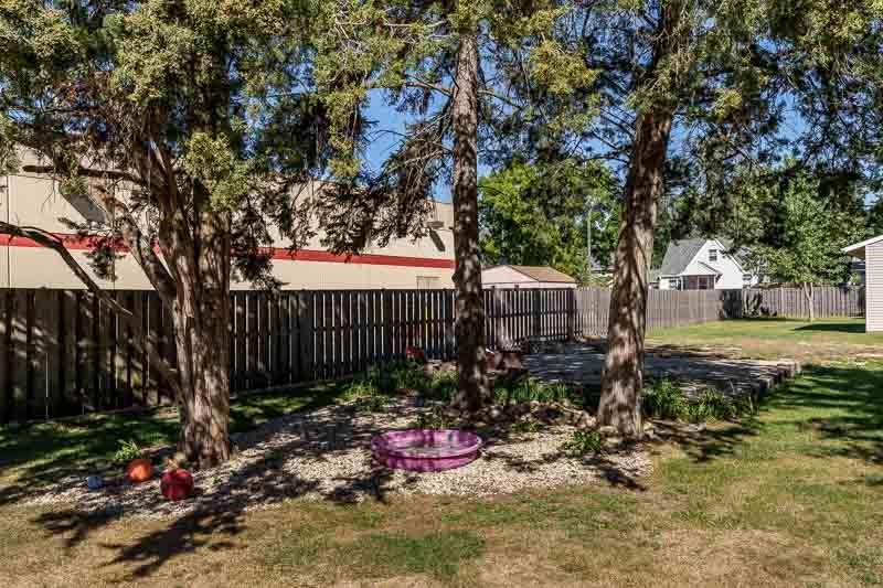 620 Harlem Road Machesney Park, IL 61115 - Photo 34 of 42 a view of a garden with large trees