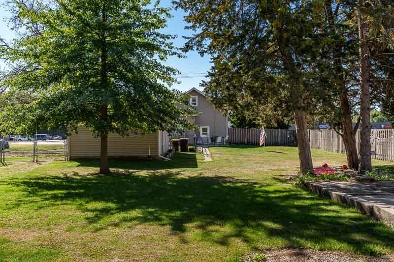 620 Harlem Road Machesney Park, IL 61115 - Photo 36 of 42 a view of a backyard with large trees