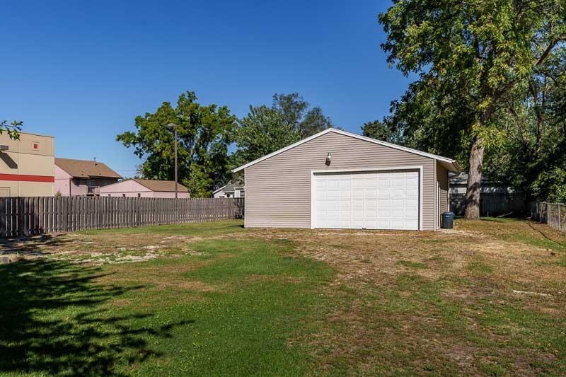 620 Harlem Road Machesney Park, IL 61115 - Photo 37 of 42 a view of big yard next to a house with large trees