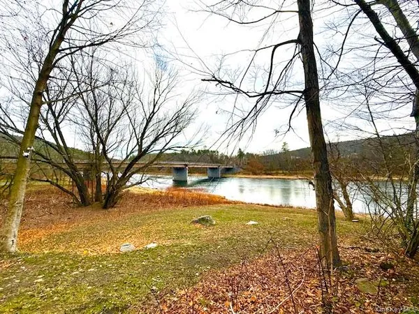 a view of lake with a yard