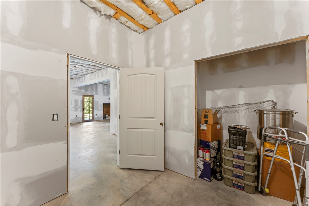 579 Terrapin Crossing Road Pickens, SC 29671 - Photo 39 of 50 A spacious, unfinished interior awaiting personalized finishes, with a glimpse of an exterior door and natural light.