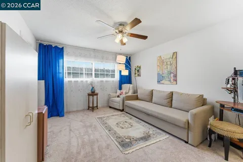 a living room with furniture and windows