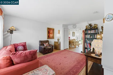 a bedroom with furniture and a flat screen tv