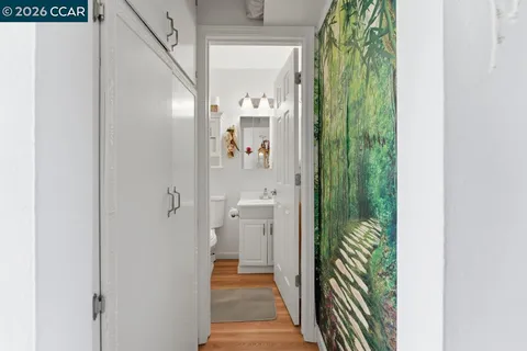 a view of a bathroom from a hallway