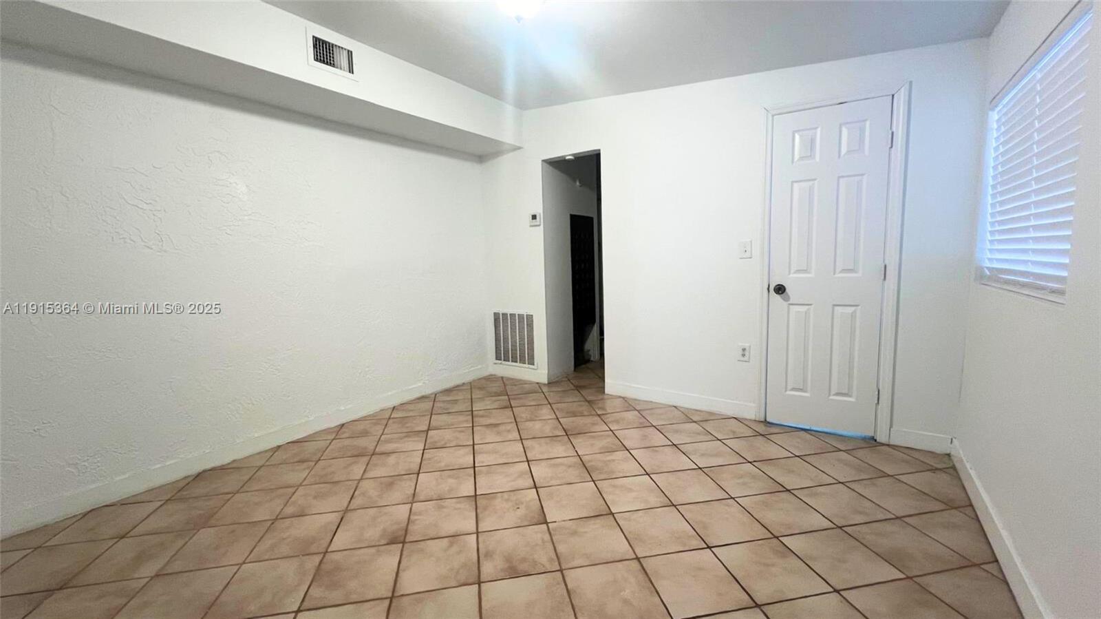 6481 Southwest 39th Terrace, Unit 2 Miami, FL 33155 - Photo 4 of 7 a view of an empty room