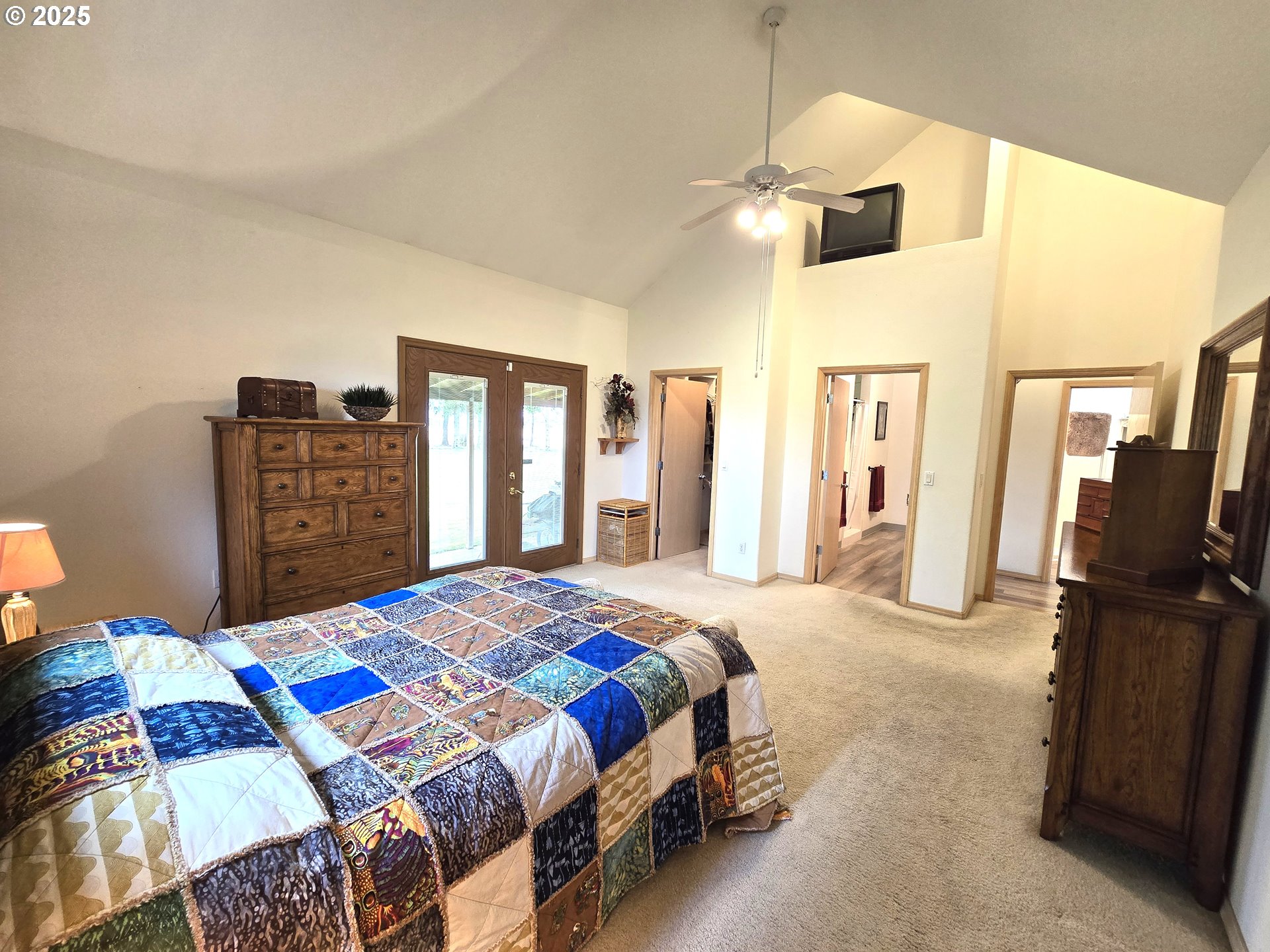 80393 Zimmer Lane Hermiston, OR 97838 - Photo 15 of 46 a bedroom with a bed and dresser with mirror