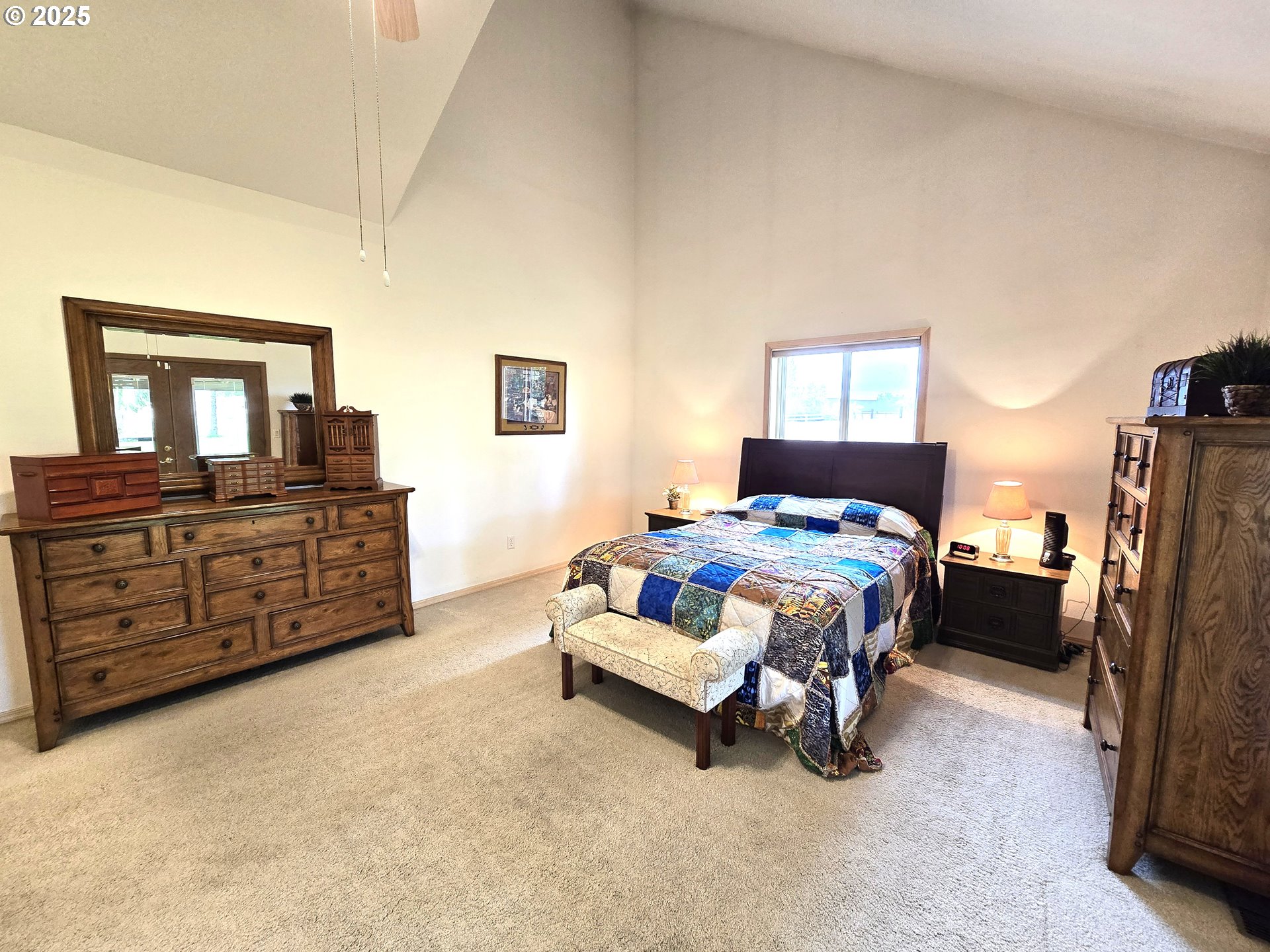 80393 Zimmer Lane Hermiston, OR 97838 - Photo 16 of 46 a spacious bedroom with a bed and dresser