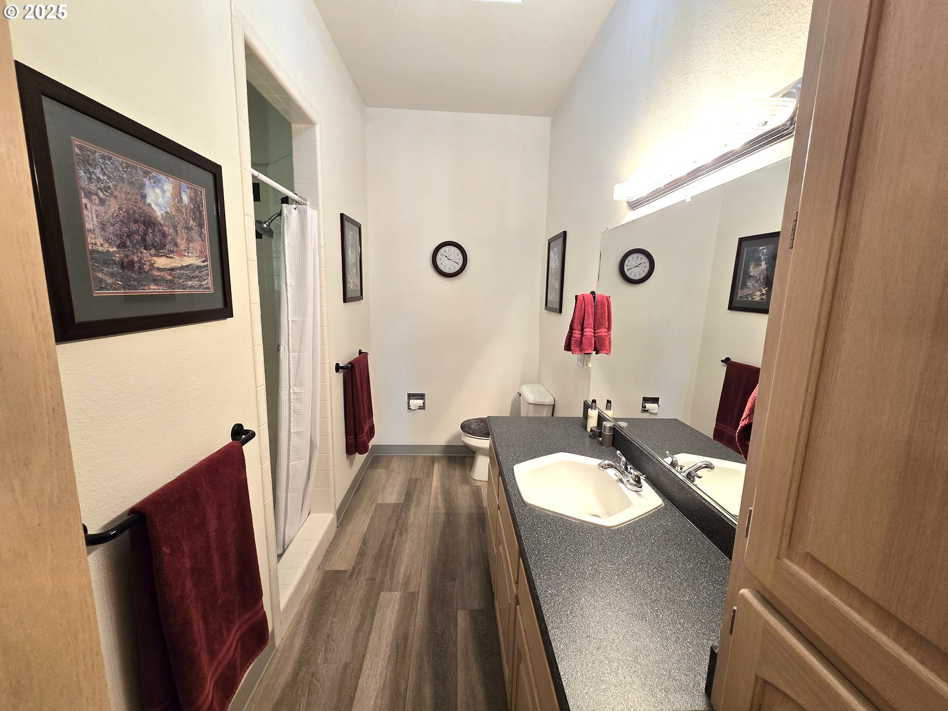 80393 Zimmer Lane Hermiston, OR 97838 - Photo 17 of 46 a bathroom with a granite countertop sink and a mirror