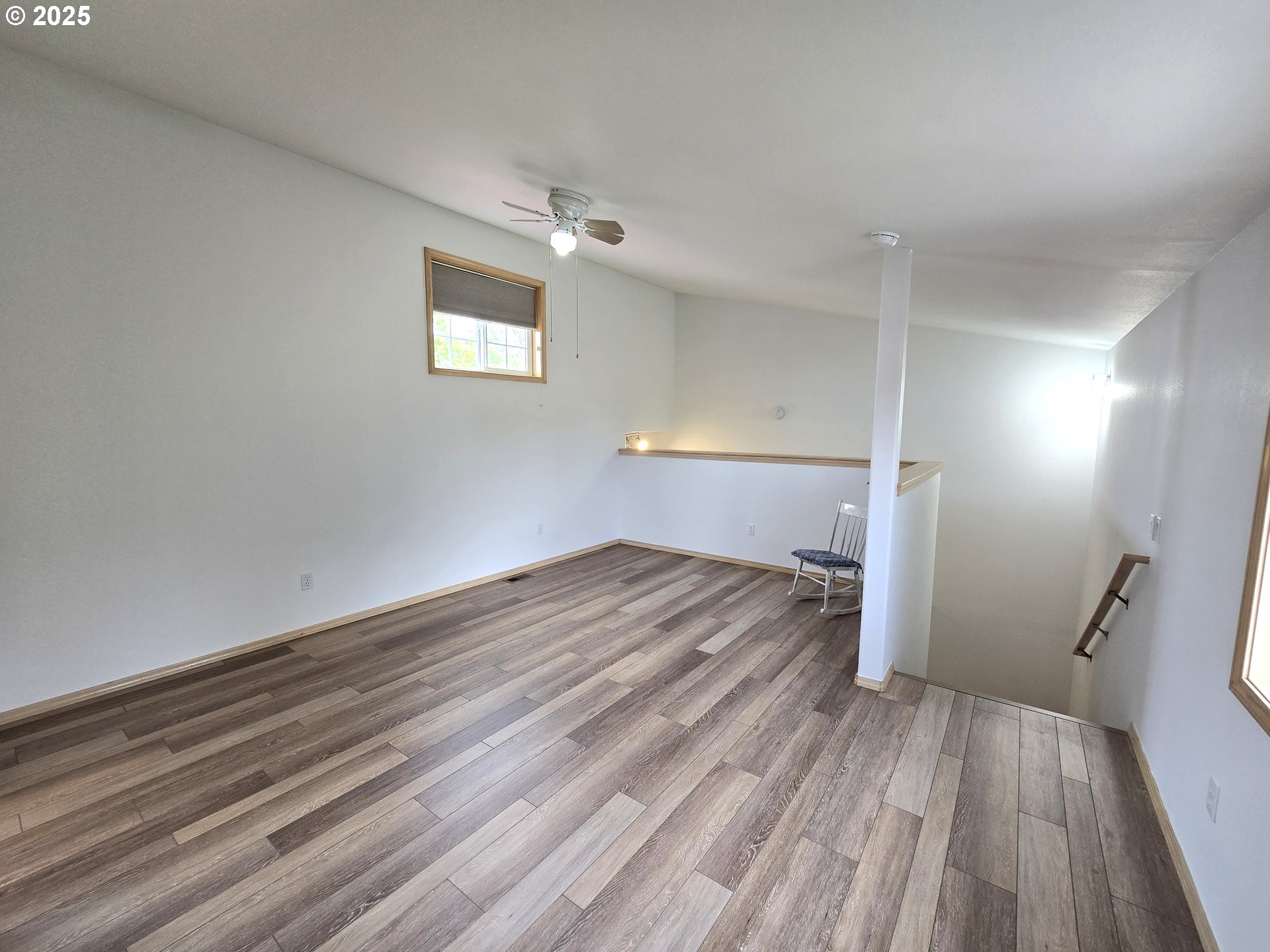 80393 Zimmer Lane Hermiston, OR 97838 - Photo 24 of 46 wooden floor in an empty room with a window